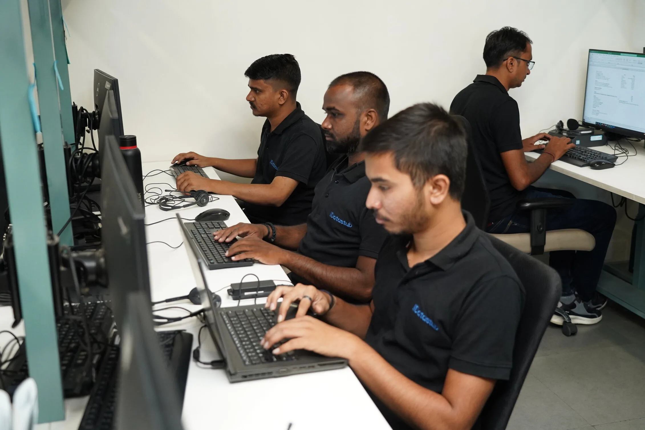 Datastub employees working in the company's office workspace