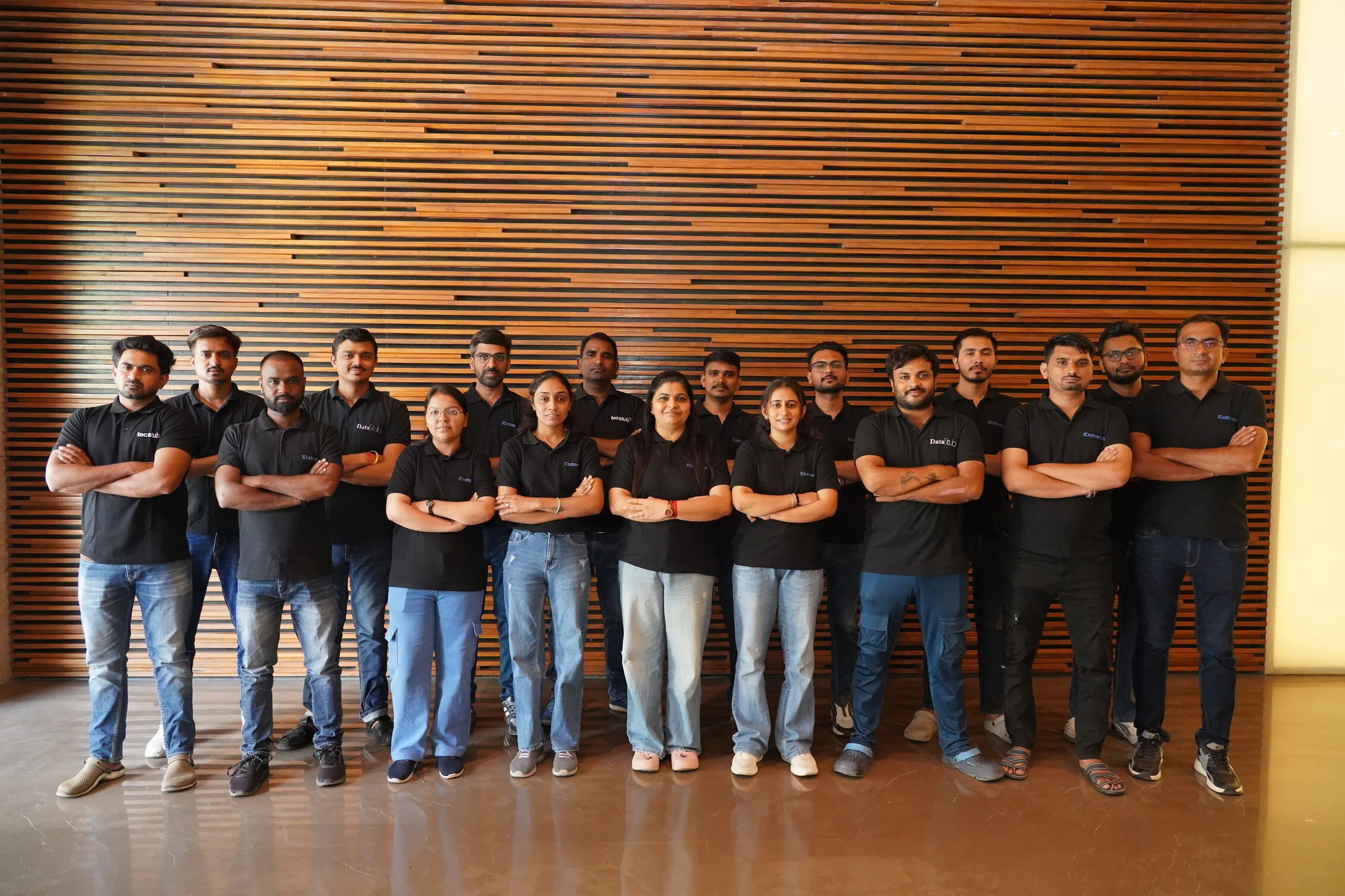 Datastub team members standing together in the office