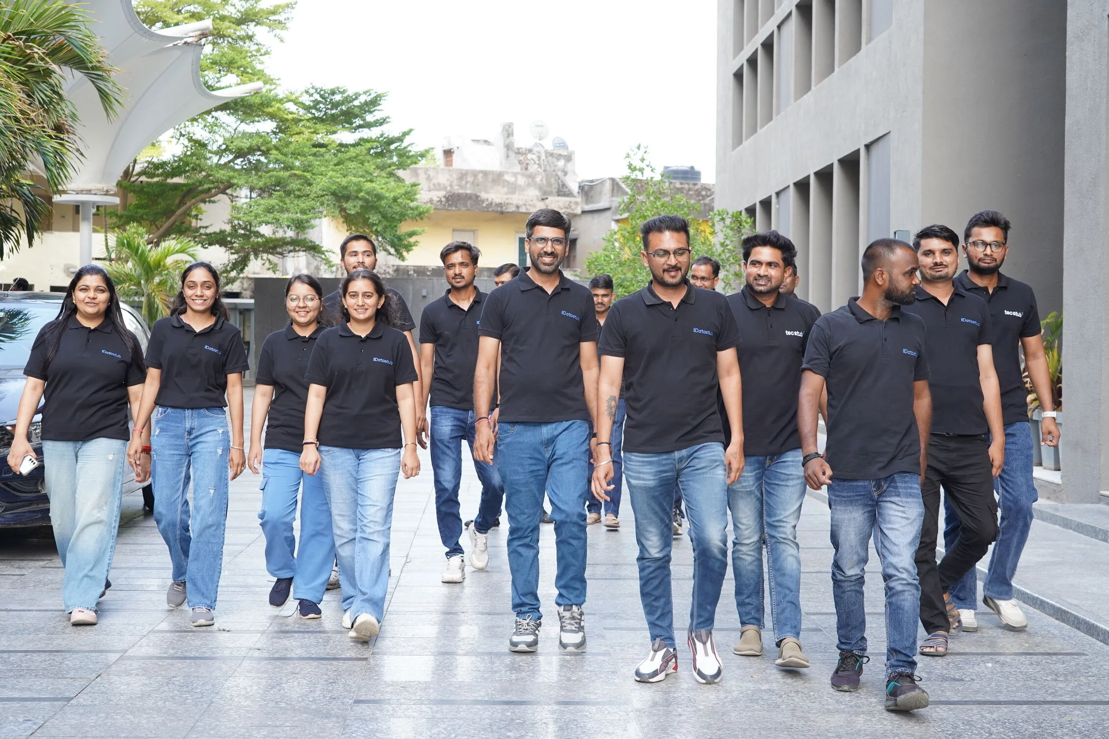 Datastub team members standing together in the office