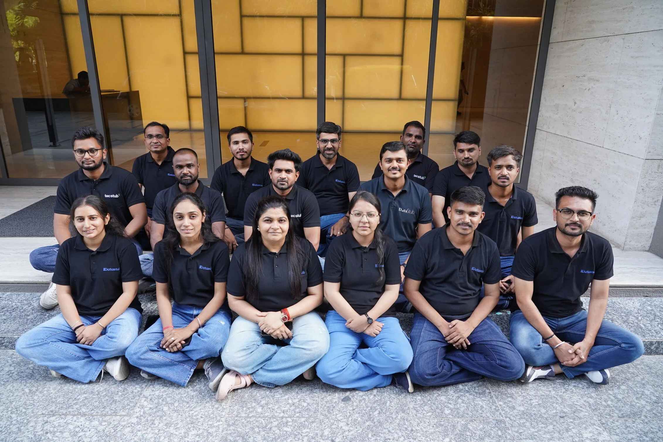 Datastub team members standing together in the office