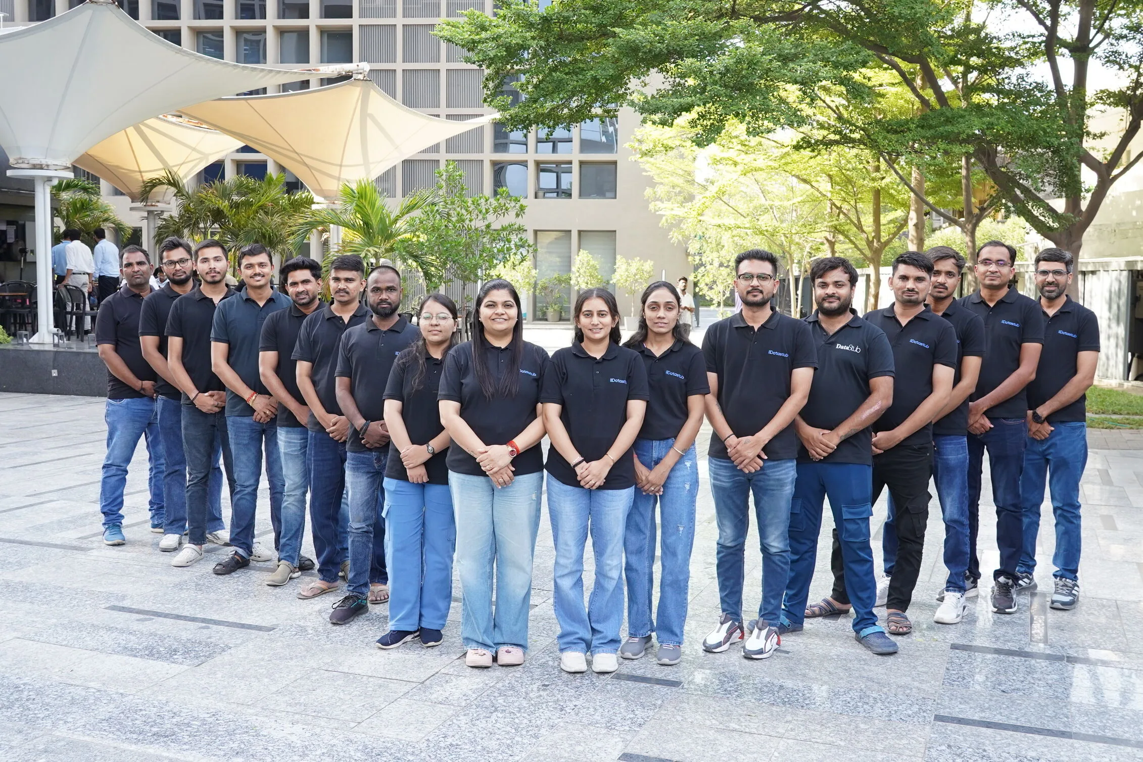 Datastub team members standing together in the office