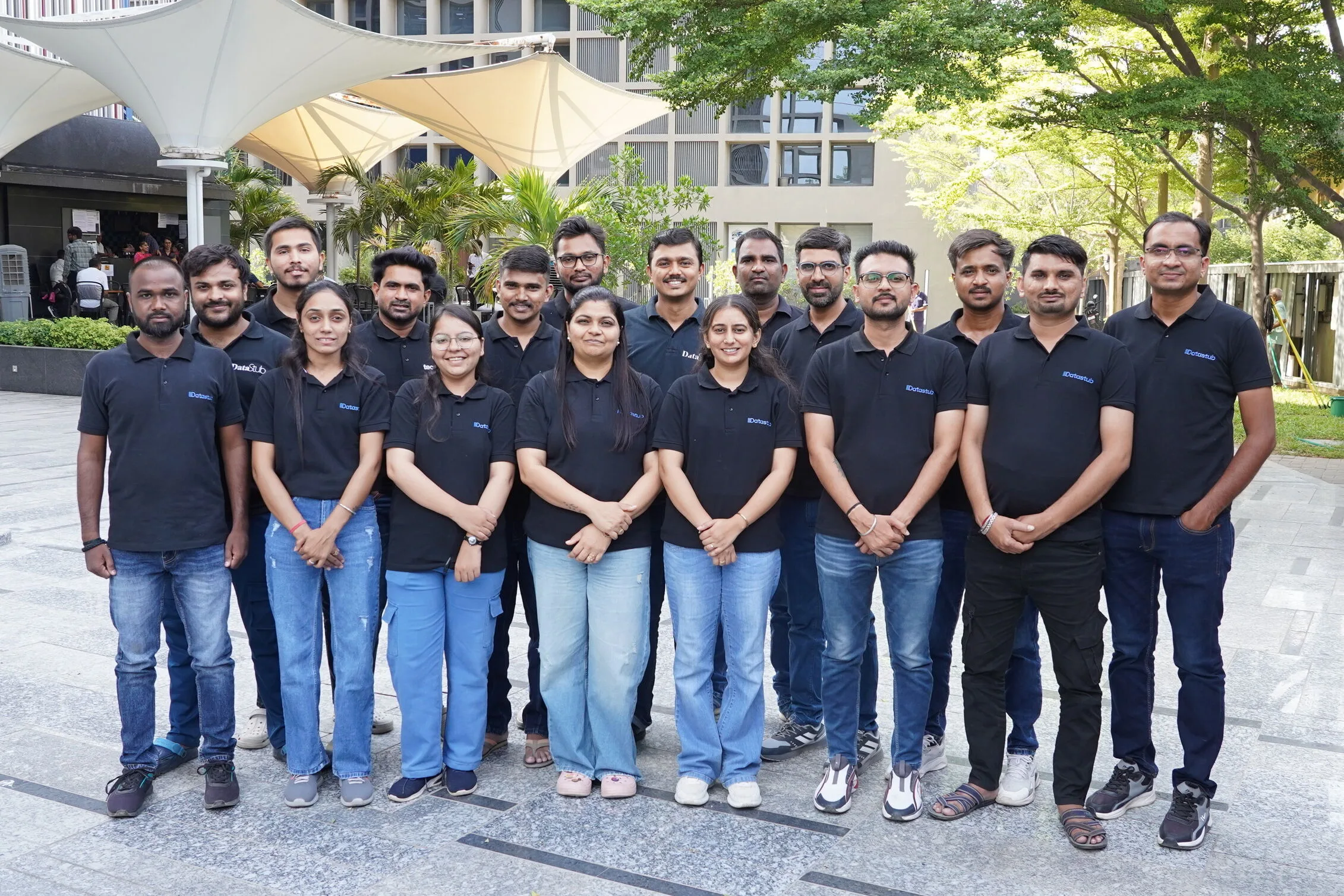Datastub team members standing together in the office